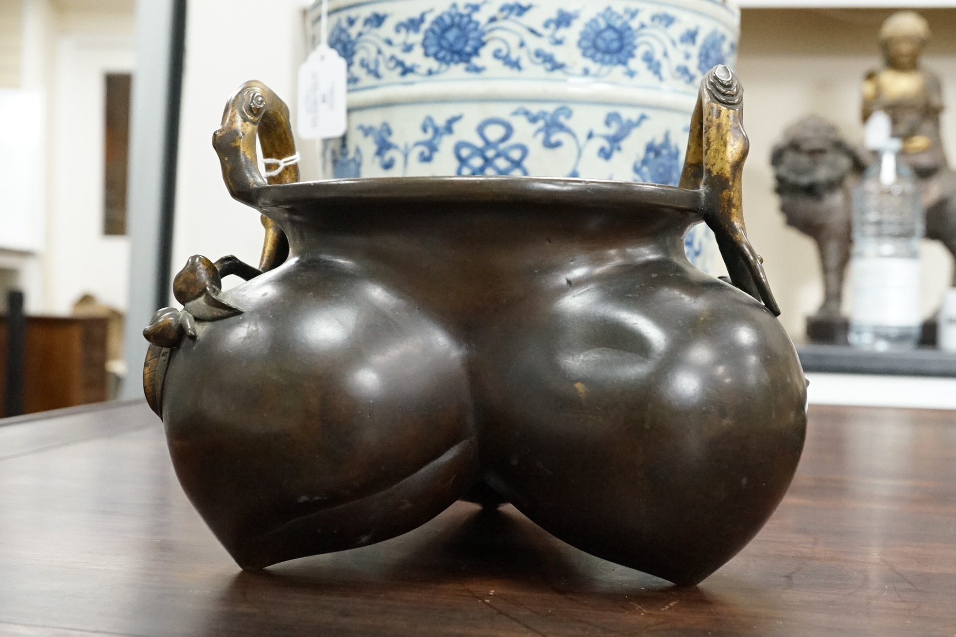 A large Chinese bronze and parcel gilt ‘peach’ censer and cover, Li, 17th/18th century